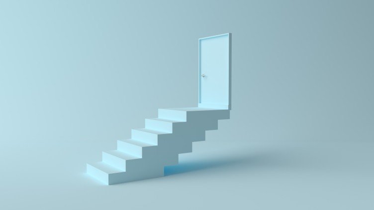 a white staircase leading to a door in air